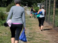 Participants walk back toward the parking lot after instructor Tracy Clarke, leads participants in a yoga classs as part of the Summer Yoga Series held at the DNRT  Slocums River Reserve on Horseneck Road in Dartmouth.   [ PETER PEREIRA/THE STANDARD-TIMES/SCMG ]