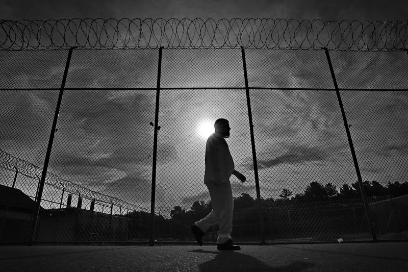 An inmate walks back to his cell after eating breakfast at the Bristol County House of Correction in Dartmouth, MA.  PHOTO PETER PEREIRA