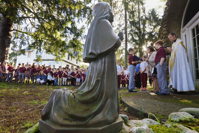 Father Riley Williams offers prayers before he blesses the animals/pets of students who attend the St. Francis Xavier School in Acushnet, MA on feast day of St. Francis of Assisi reknown for his love of animals.  PHOTO PETER PEREIRA