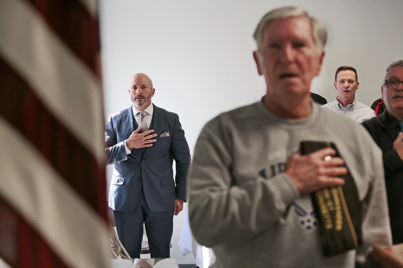 Veteran of the Year, Christopher Azevedo, along with fellow veterans, Jim Collins, Jim Reid and Roy Oliveira, pledge allegiance to the flag at the veterans breakfast held at the Dartmouth Council on Aging in Dartmouth, MA.  PHOTO PETER PEREIRA