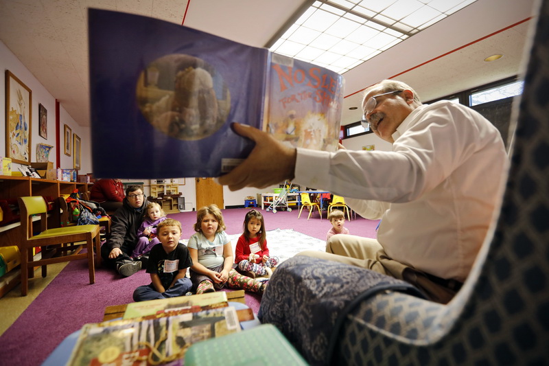 Southwood Library librarian, Brian Walsh, reads books with a barn/farm theme, during the Preschool Storytime session held on Friday's at the Dartmouth library, as folks enjoy activities other than shopping on Black Friday. PHOTO PETER PEREIRA