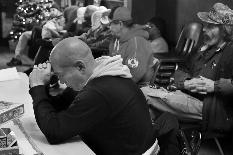 Mike Silvia becomes emotional as he and other veterans living at the Veterans Transition House in New Bedford, MA listen to fellow veteran Chris Azevedo tell his story of his battle with PTSD and addiction.  This is part of an ongoing project I am doing on veterans dealing with addiction and suicide.   PHOTO PETER PEREIRA
