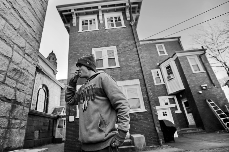 Navy veteran, Steve Viveiros, goes for a smoke outside of the Veterans Transition House in New Bedford, MA after putting his laundry in the machine.  The VTH is currently located inside the former rectory of the St John the Baptist church on County Street was the first Portuguese catholic church in the United States, and has been unoccupied since 2012.  Steve who has been living at the VTH for the last six months, is trying to get back on his feet, and has recently found a job working at a local hotel.  PHOTO PETER PEREIRA