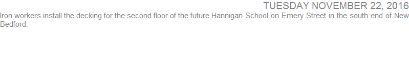Iron workers install the decking for the second floor of the future Hannigan School on Emery Street in the south end of New Bedford.