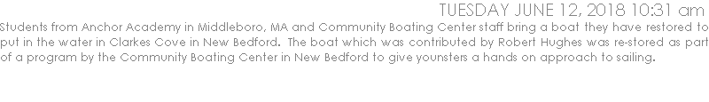 Students from Anchor Academy in Middleboro, MA and Community Boating Center staff bring a boat they have restored to put in the water in Clarkes Cove in New Bedford.  The boat which was contributed by Robert Hughes was re-stored as part of a program by the Community Boating Center in New Bedford to give younsters a hands on approach to sailing