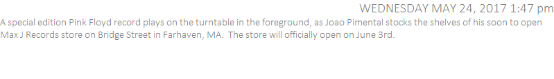 A special edition Pink Floyd record plays on the turntable in the foreground, as Joao Pimental stocks the shelves of his soon to open Max J Records store on Bridge Street in Farhaven, MA.  The store will officially open on June 3rd.