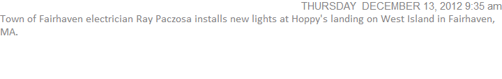 Town of Fairhaven electrician Ray Paczosa installs new lights at Hoppy's landing on West Island in Fairhaven, MA.