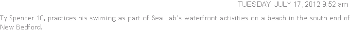 Ty Spencer 10, practices his swiming as part of Sea Lab's waterfront activities on a beach in the south end of New Bedford.