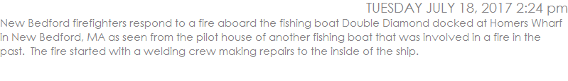 New Bedford firefighters respond to a fire aboard the fishing boat Double Diamond docked at Homers Wharf in New Bedford, MA as seen from the pilot house of another fishing boat that was involved in a fire in the past.  The fire started with a welding crew making repairs to the inside of the ship. 