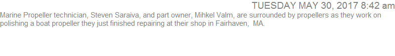 Marine Propeller technician, Steven Saraiva, and part owner, Mihkel Valm, are surrounded by propellers as they work on polishing a boat propeller they just finished repairing at their shop in Fairhaven,  MA.