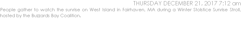 People gather to watch the sunrise on West Island in Fairhaven, MA during a Winter Stolstice Sunrise Stroll, hosted by the Buzzards Bay Coalition.