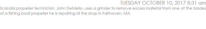 Scandia propeller technician, John DeMello, uses a grinder to remove excess material from one of the blades of a fishing boat propeller he is repairing at the shop in Fairhaven, MA.