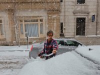 Neil Alexander wipes the snow from the rear window of his car parked on William Street in downtown New Bedford as a snow storm rolls over the area.   [ PETER PEREIRA/THE STANDARD-TIMES/SCMG ]