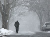 A man doesn't let the snow keep him from going for a morning run in Fairhaven.   [ PETER PEREIRA/THE STANDARD-TIMES/SCMG ]