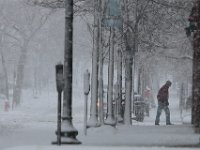A man make his way up Pleasant Street in downtown New Bedford as another late season snow storm covers the area.   [ PETER PEREIRA/THE STANDARD-TIMES/SCMG ]