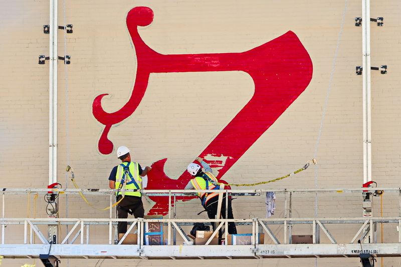 Painters paint the iconic Z on the side of the Zeiterion Performing Arts Center in New Bedford, MA which is currently undergoing an extensive restoration/renovation project. PHOTO PETER PEREIRA