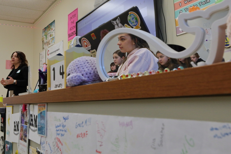 Ninth graders are reflected on a whale shaped mirror as they listen to hair stylist Nancy Silva, left, speak about her career during the annual Career Day at Dartmouth Middle School. PHOTO PETER PEREIRA