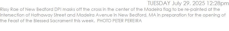 Rissy Rae of New Bedford DPI masks off the cross in the center of the Madeira flag to be re-painted at the intersection of Hathaway Street and Madeira Avenue in New Bedford, MA in preparation for the opening of the Feast of the Blessed Sacrament this week.  PHOTO PETER PEREIRA