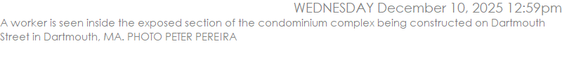 A worker is seen inside the exposed section of the condominium complex being constructed on Dartmouth Street in Dartmouth, MA. PHOTO PETER PEREIRA
