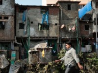 MG 1736  Daily life in the Dharbi slum in Mumbai, India.  The Dharbi slum is one of the largest in India and contains an entire ecosystem that offers residents the ability to never leave. : India