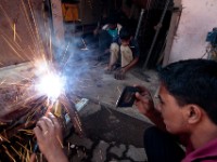 MG 1781  Daily life in the Dharbi slum in Mumbai, India.  The Dharbi slum is one of the largest in India and contains an entire ecosystem that offers residents the ability to never leave. : India