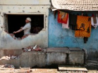 MG 1879  Daily life in the Dharbi slum in Mumbai, India.  The Dharbi slum is one of the largest in India and contains an entire ecosystem that offers residents the ability to never leave. : India