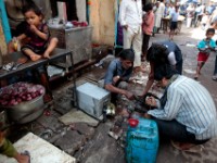 MG 1910  Daily life in the Dharbi slum in Mumbai, India.  The Dharbi slum is one of the largest in India and contains an entire ecosystem that offers residents the ability to never leave. : India