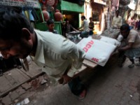 MG 1937  Daily life in the Dharbi slum in Mumbai, India.  The Dharbi slum is one of the largest in India and contains an entire ecosystem that offers residents the ability to never leave. : India