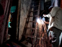 MG 1995  Daily life in the Dharbi slum in Mumbai, India.  The Dharbi slum is one of the largest in India and contains an entire ecosystem that offers residents the ability to never leave. : India