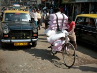 MG 2036  Daily life in the Dharbi slum in Mumbai, India.  The Dharbi slum is one of the largest in India and contains an entire ecosystem that offers residents the ability to never leave. : India