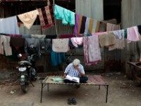 MG 2039  Daily life in the Dharbi slum in Mumbai, India.  The Dharbi slum is one of the largest in India and contains an entire ecosystem that offers residents the ability to never leave. : India