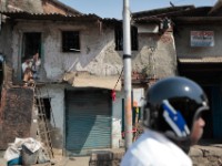 MG 2067  Daily life in the Dharbi slum in Mumbai, India.  The Dharbi slum is one of the largest in India and contains an entire ecosystem that offers residents the ability to never leave. : India